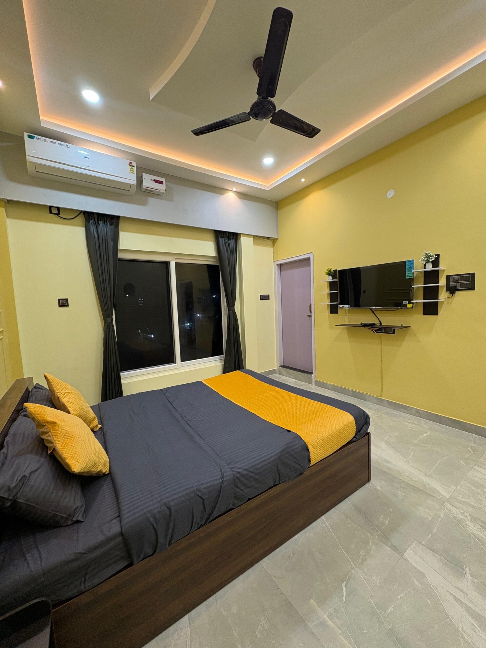 Home yellow bedroom with tv